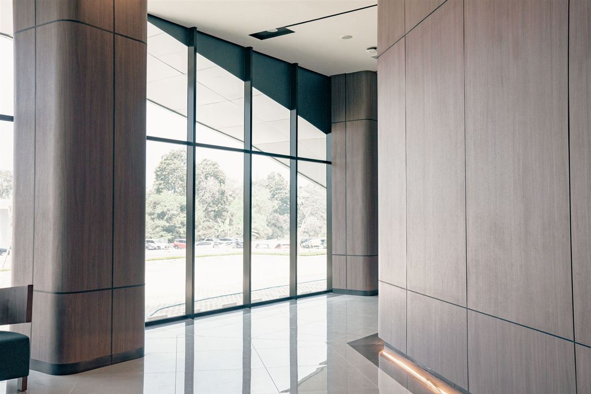 Polished, reflective floor in a commercial building corridor