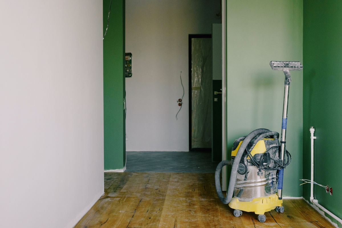 Industrial vacuum in a newly renovated room during post-construction cleanup