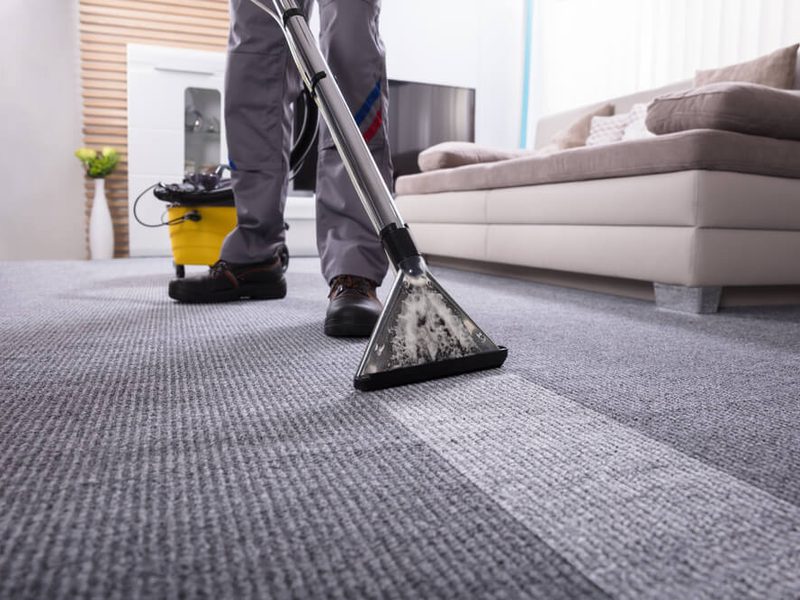 Commercial carpet cleaning technician extracting carpet in a Charlotte NC office