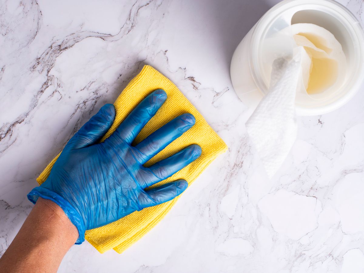 Disinfection services technician treating high-touch surfaces in a Charlotte NC facility